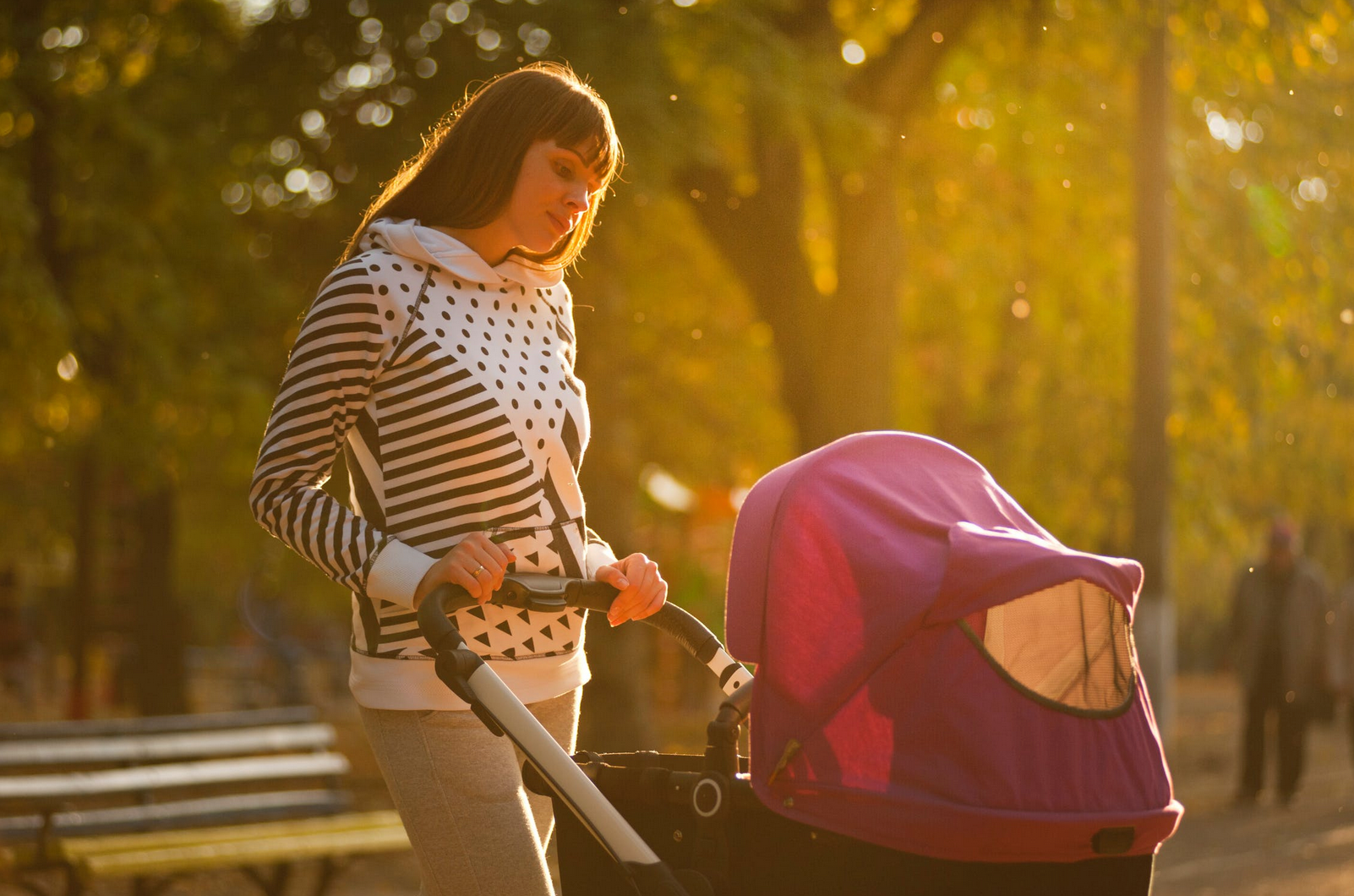tall woman using stroller