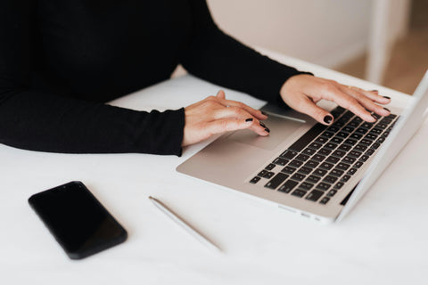 Photo by Karolina Grabowska: https://www.pexels.com/photo/crop-faceless-woman-working-on-netbook-in-office-4467735/