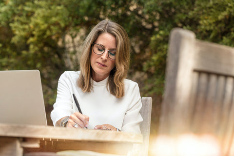 Sales Woman making a list of her network