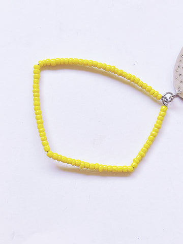 yellow beaded geometric shape