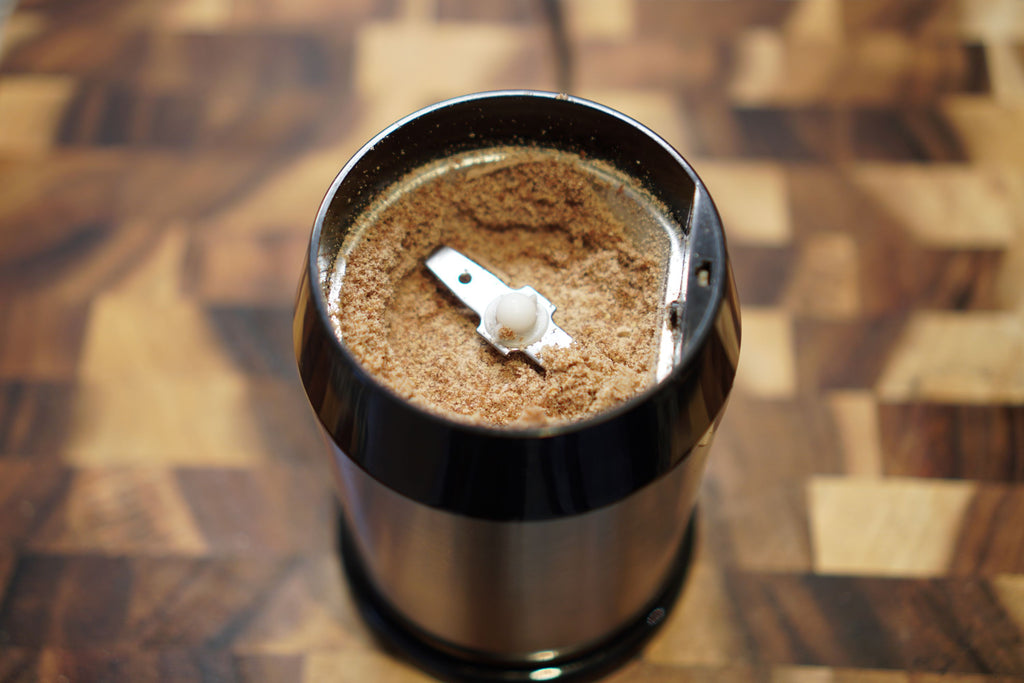 ground flax seeds in a small coffee grinder