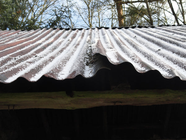 Snow on a corregated tin roof, white stripes