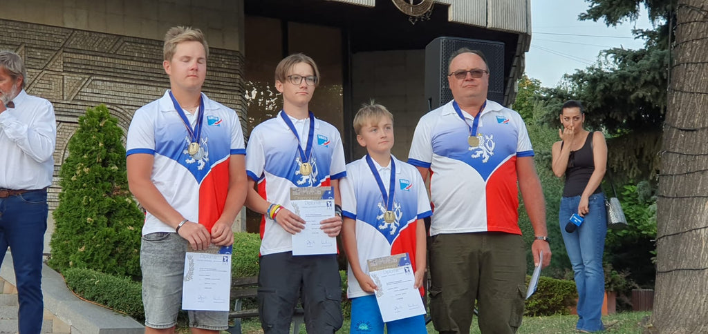 Czech Junior team with Team Manager on podium