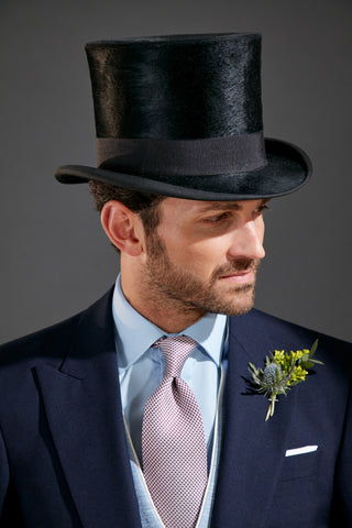 Model wearing Oliver Brown top hat