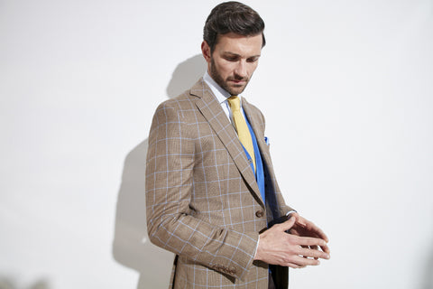 Model wearing Oliver Brown Onslow Jacket made with a check Loro Piana 