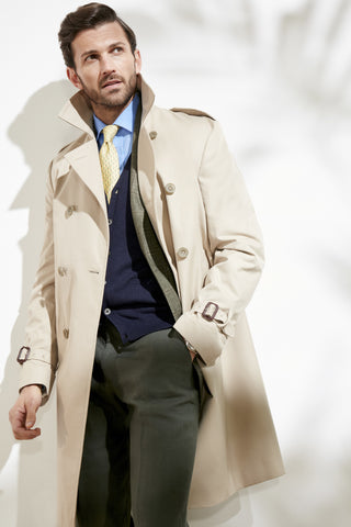 Model wearing an Oliver Brown trench coat in Camel