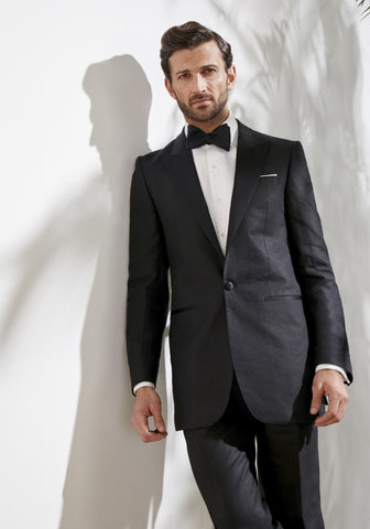 Model wearing an Oliver Brown Carlyle Dinner Jacket in Black Linen