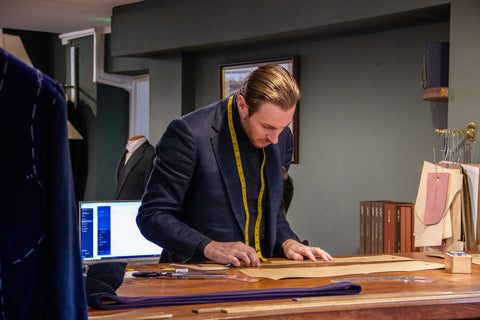 Mike Deans, head cutter, striking out a garment in the Sloane Street Bespoke space.