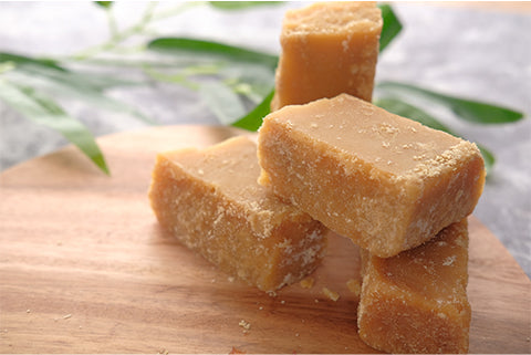 Blocks of light yellow adulterated jaggery