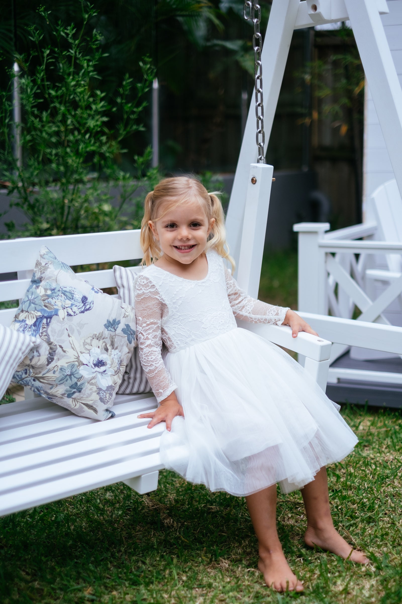 white outdoor swing bench