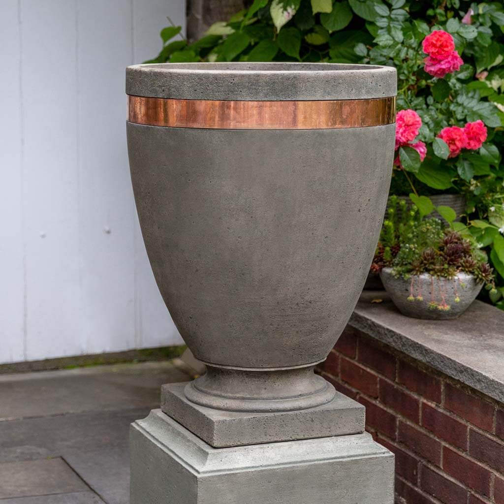 https://cdn.shopify.com/s/files/1/0566/4492/7571/products/p782-moderne-tall-planter-cast-stone-planters-as.jpg?v=1697804559