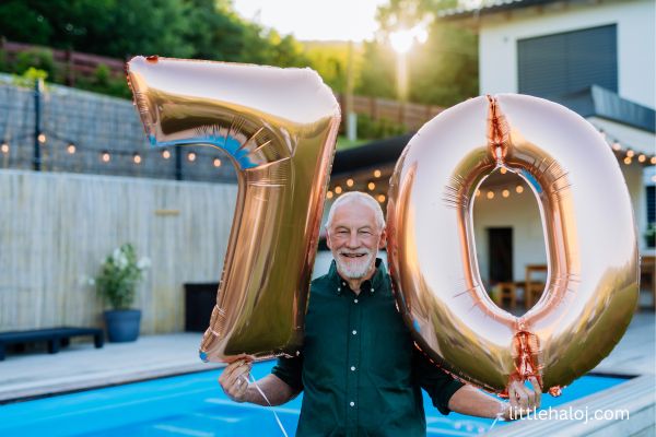 Man with 70th birthday balloons