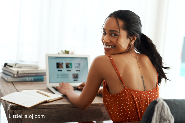 Teen at her computer blogging