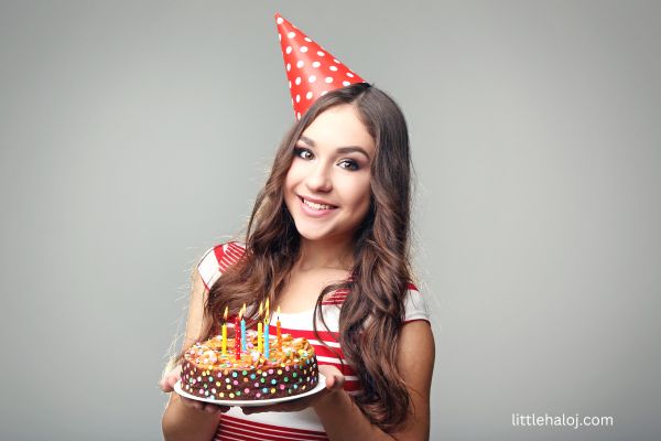 Teen girl holding cake