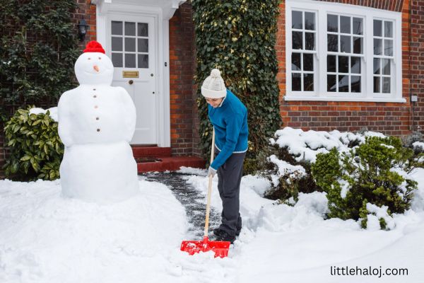 Teen shoveling snow for elderly neighbor