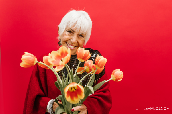Senior citizen lady with bunch of Tulips