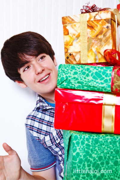 Teenage boy with Christmas Gifts