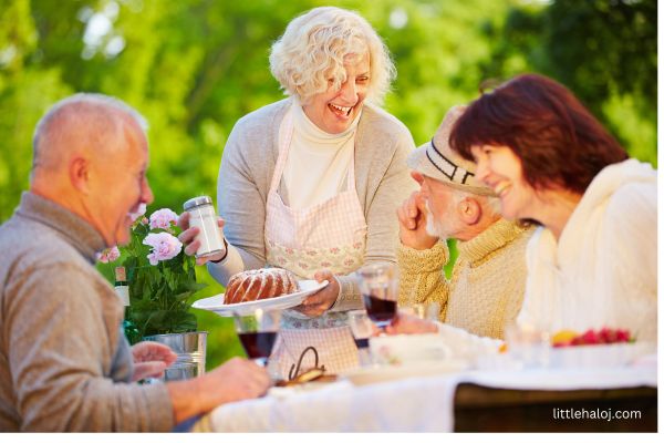 Elderly people eating cake