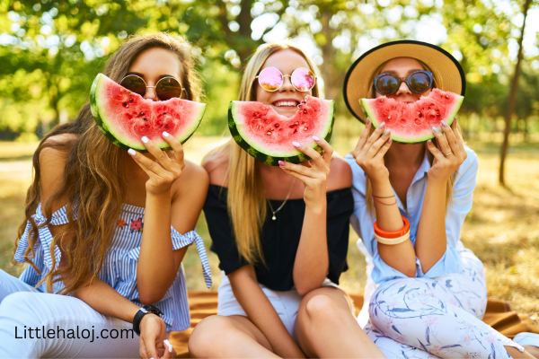 3 ladies with watermelon slices