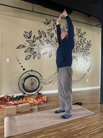 Men in Yoga Maksim in Hands Overhead Pose Urdhva Hastasana Yoga