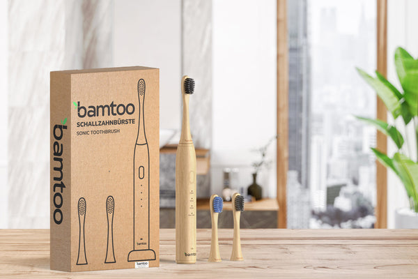 Sustainable sonic toothbrush from bamtoo in a bright bathroom