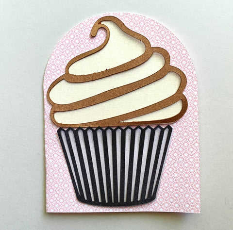 a handmade cupcake card on a pink patterned background