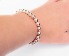 Classic 14k white gold ball large bead bracelet.  Perfect for a man or a woman.  Model View.