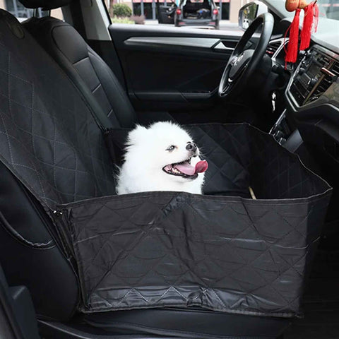 small white dog inside foldable pet car seat