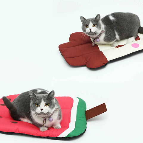 Two cats laying on fruit design pet cooling mats