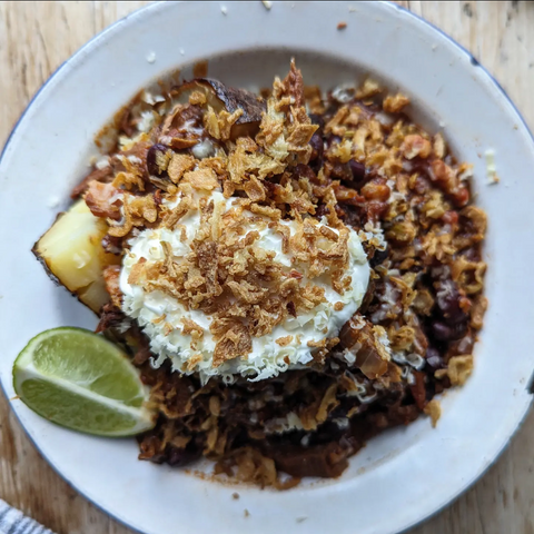 BBQ Brisket Chilli with sour cream, grated cheese and crispy dried onions