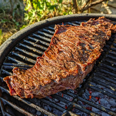 T&G signature bavette steak cut grilling on the BBQ over hot heat