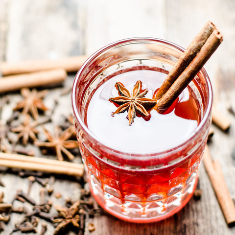 Glass of mulled wine with cinnamon stick and Star anise