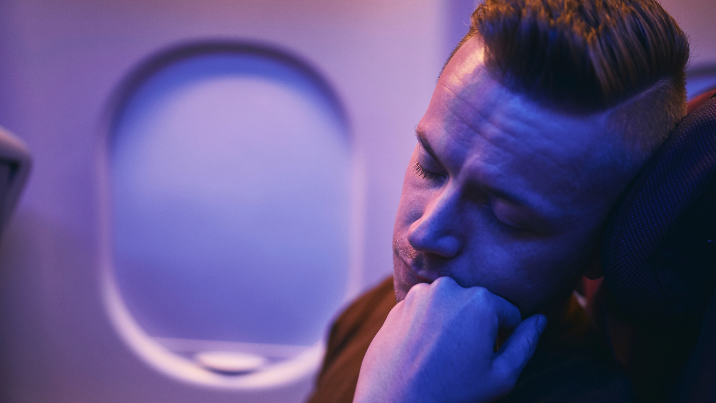 guy asleep on a flight
