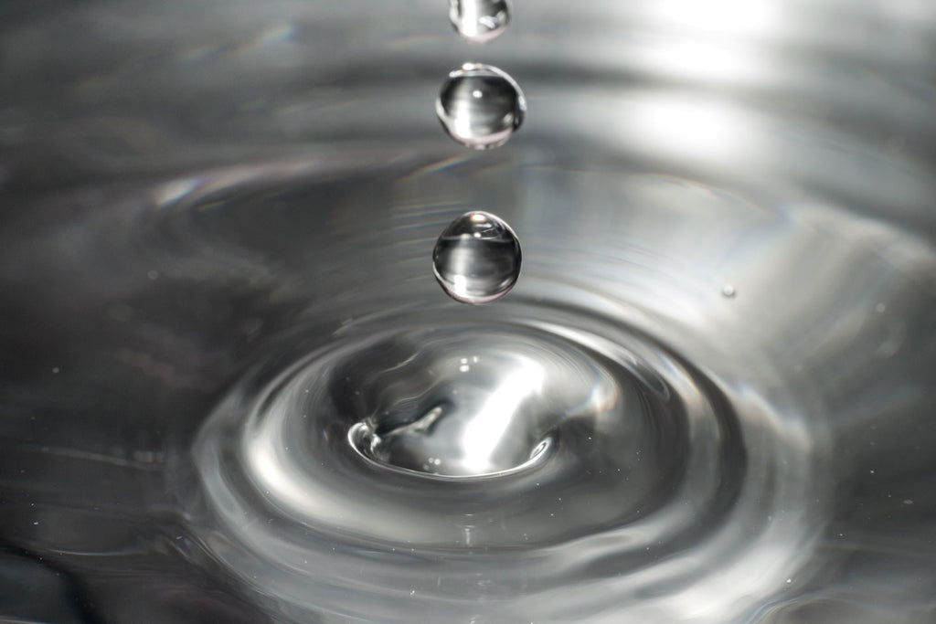 Drops of clear liquid and concentric landing circles