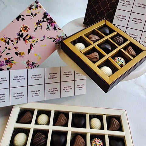 Assortment of plain, flavored, and filled chocolates in a classic collection of white, milk, and dark chocolates. World Chocolate Day. Best Chocolate Goodies. Corporate Office Celebrations.