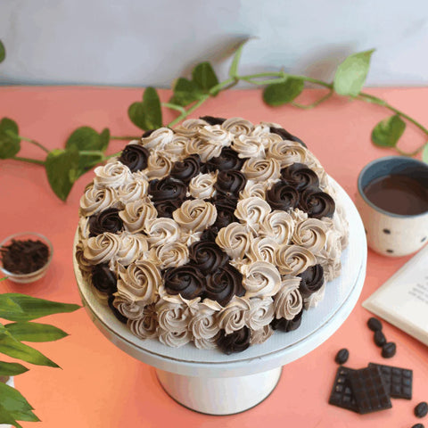 Scrumptious chocolate coffee cake layered with coffee whipped cream and topped with rosettes. World Chocolate Day. Best Chocolate Goodies. Corporate Office Celebrations.