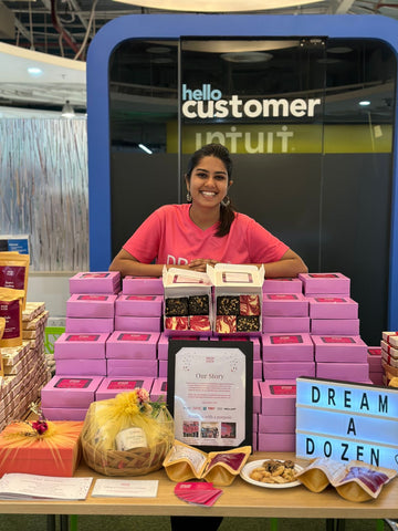 Megna Jain smiling at the camera at a Corporate To Go Order at Intuit. Best Gift Hampers. Small Business. 