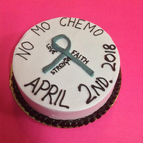 Cake symbolising the end of brain cancer for a young female patient after a long and hard battle. Has a grey ribbon with the caption "No Mo Chemo" along with the date of 2nd April, 2018