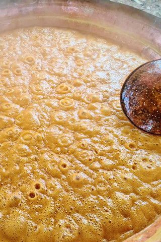 making sugarcane jaggery begins with extracting the juice