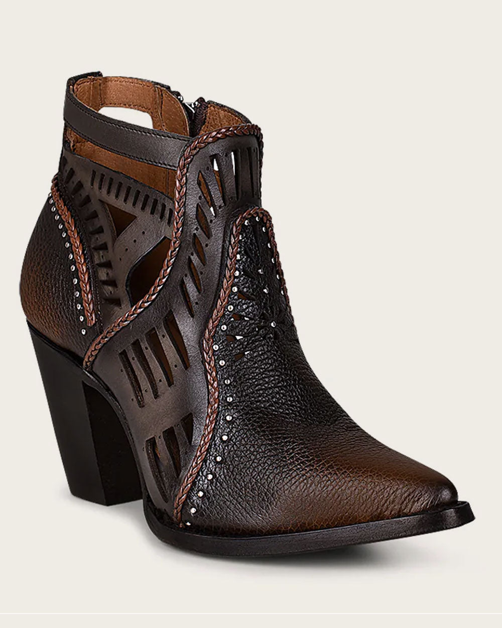 Cuadra - 4I07RS: Intricate geometric motifs and perforations on boots.