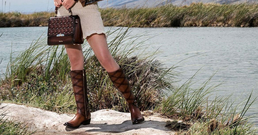 Women beside a lake wearing Cuadra tall knee boots