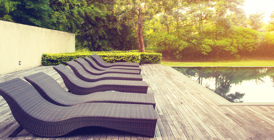 Find the right outdoor furniture to attract guests to your poolside, like this set of outdoor lounges.