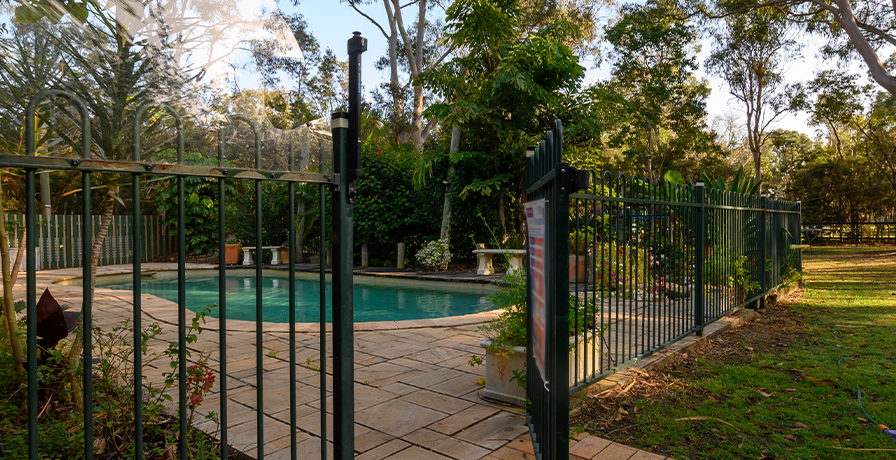 A fence is a great way to not only protect your family but to accent your poolside.