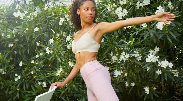 The Supportive Sports Bra You Need Now - woman doing yoga in sports bra