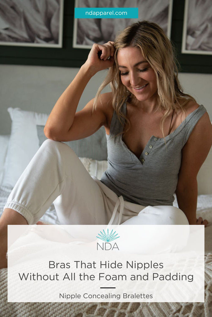 girl sitting on bed in grey shirt and khaki pants - pinterest pin for Bras That Hide Nipples Without All the Foam and Padding