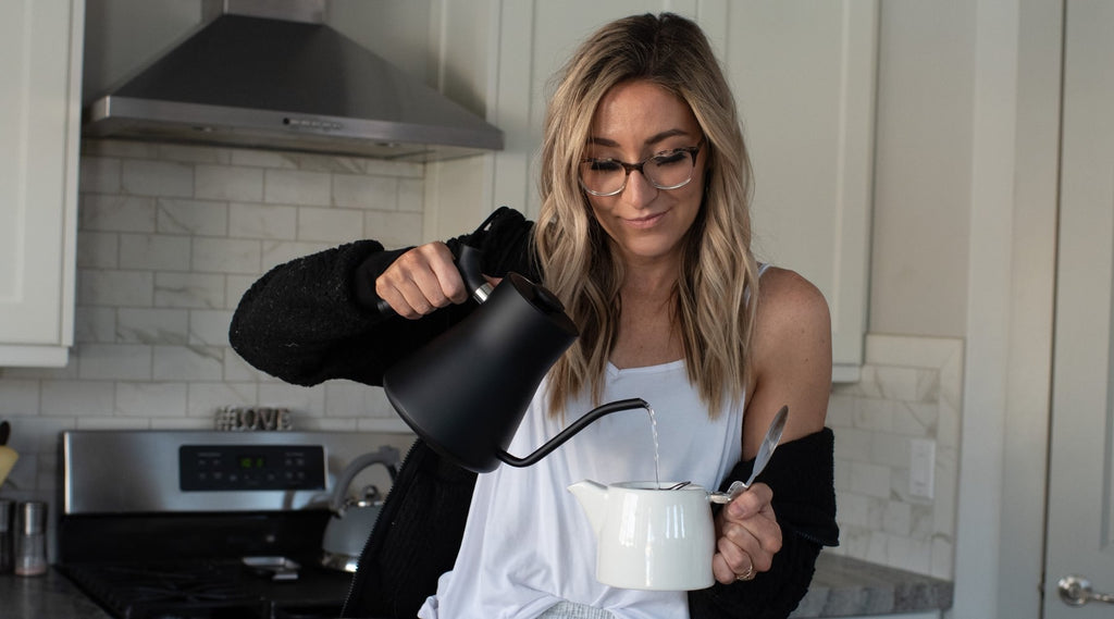 Busting Myths About Bras - girl pouring water in a coffee mug