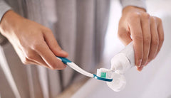 A man about to brush his teeth