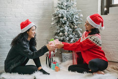 Friends exchanging gifts for the Holiday