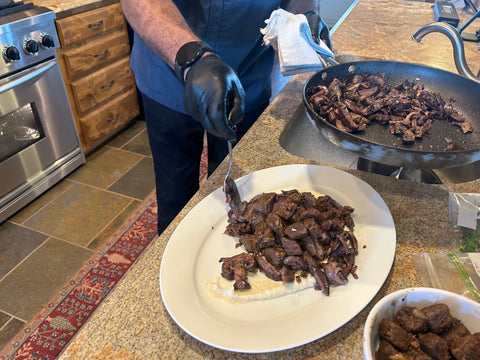 Sauteed mushrooms go on top next.