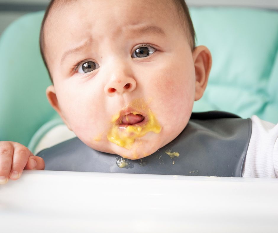 Baby with food around mouth